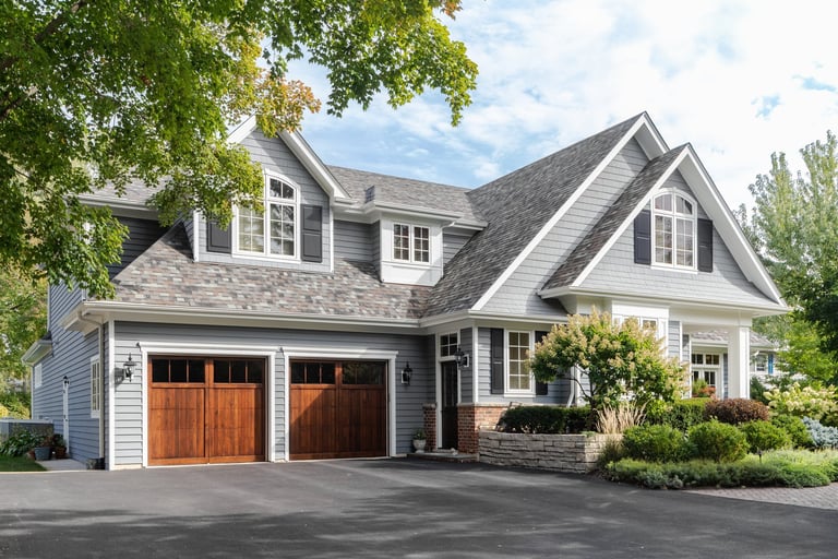 Beautiful home with professionally maintained lawn, clean driveway, and well-landscaped yard